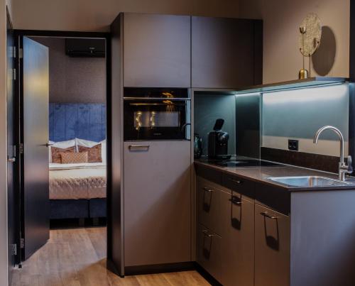 Η κουζίνα ή μικρή κουζίνα στο De Nassau - In de winkelstraat