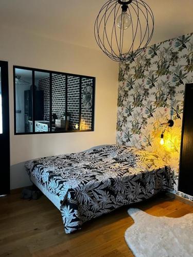 Ένα ή περισσότερα κρεβάτια σε δωμάτιο στο Studio 2 personnes au coeur du Berry