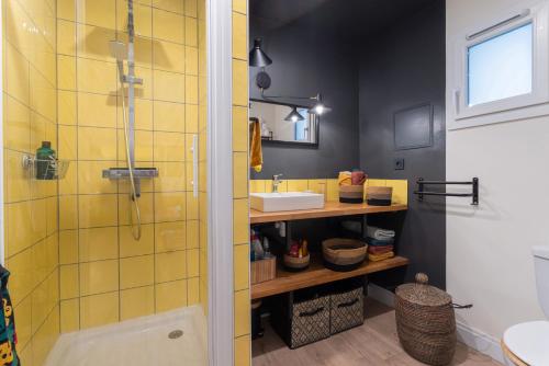 a bathroom with a sink and a shower at Céret in Céret