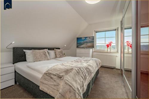 Ένα ή περισσότερα κρεβάτια σε δωμάτιο στο Landhaus am Krebssee