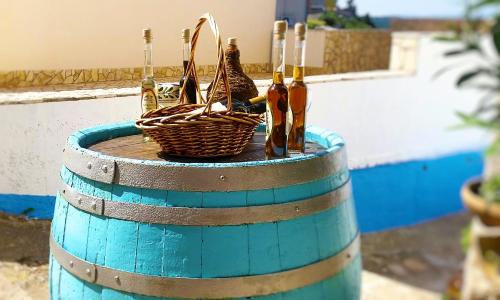 a barrel with umbrellas and baskets on top of it at Gospoja Park & Beach Apartment Vrbnik in Vrbnik