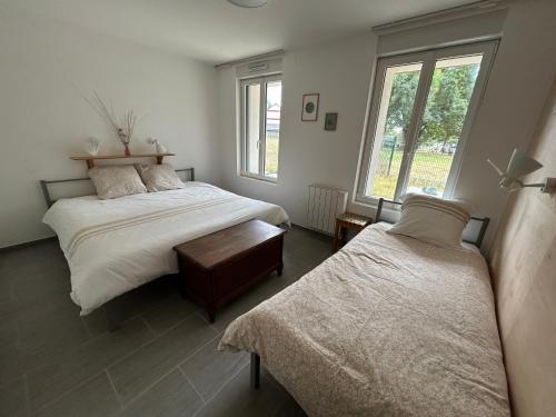 Postel nebo postele na pokoji v ubytování Gite Au fil de l'eau