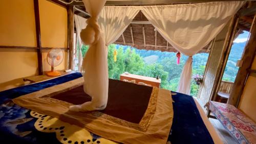 Postel nebo postele na pokoji v ubytování Hula Hula Bungalow