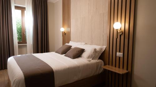 Postel nebo postele na pokoji v ubytování Guest House Aura - Lumys Fiumicino