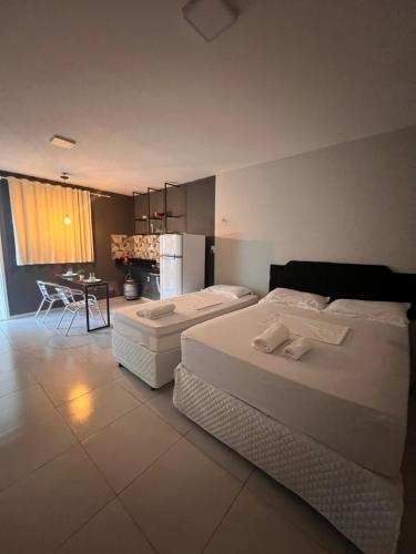 Postel nebo postele na pokoji v ubytování Pousada Flat Lourdes Residence