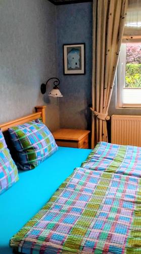 a bedroom with two beds and a window at Haus Wolfgang in Geldern