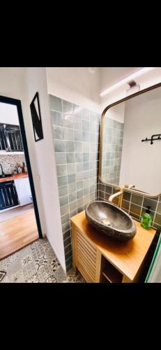 a bathroom with a sink and a mirror at T2 port Cogolin golfe de Saint-Tropez vue mer in Cogolin