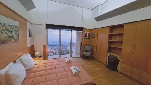 a bedroom with a bed with two stuffed animals on it at STAY Sunset Palazzo in Tala