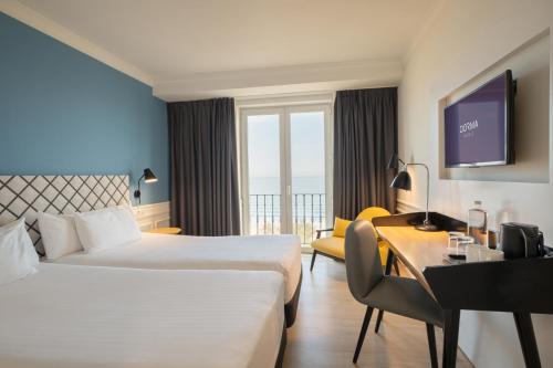 Ένα ή περισσότερα κρεβάτια σε δωμάτιο στο Dorma Sardinero