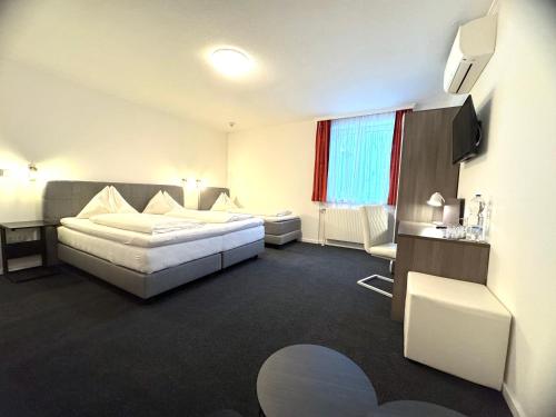 Ένα ή περισσότερα κρεβάτια σε δωμάτιο στο Hotel Altmann