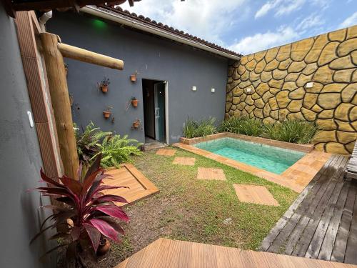 a swimming pool in the backyard of a house at chalé encanto dos milagres in São Miguel dos Milagres