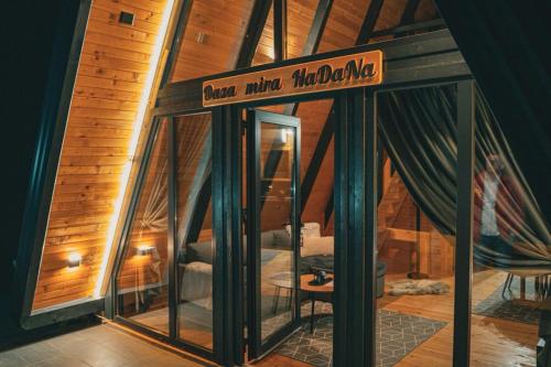 a room with a glass door with a sign on it at Oaza mira HaDaNa in Tihovići