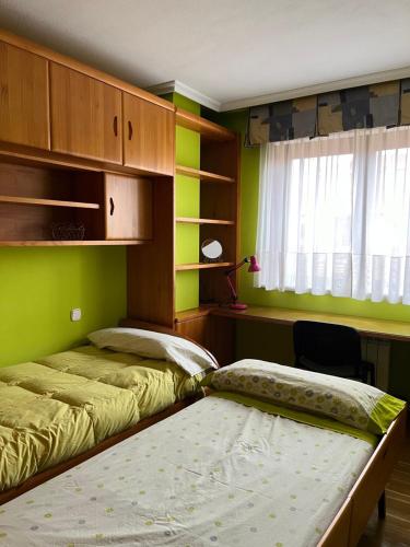 Postel nebo postele na pokoji v ubytování Casa Juanjo