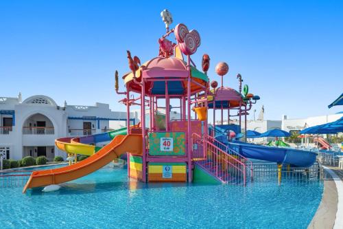 a water park with a slide in the water at Pickalbatros Palace Sharm - "Aqua Park" in Sharm El Sheikh