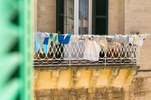 a balcony with clothes drying on a clothesline at La Casa di Ele in Matera