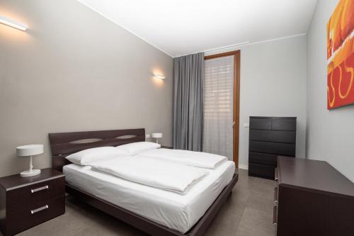 Ένα ή περισσότερα κρεβάτια σε δωμάτιο στο Appartamenti Torre del Capitano