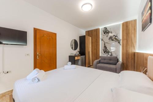 Ένα ή περισσότερα κρεβάτια σε δωμάτιο στο Hotel Riti