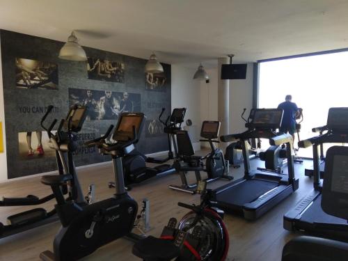 a gym with several exercise bikes in a room at Camping Playa de Ris in Noja