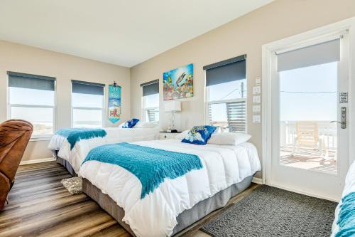 two beds in a room with windows at Stunning Beachfront Dog Friendly Sleeps 8 in Caplen
