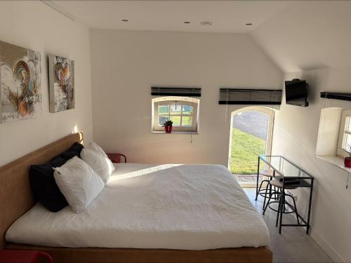 Postel nebo postele na pokoji v ubytování Saromaja B&B