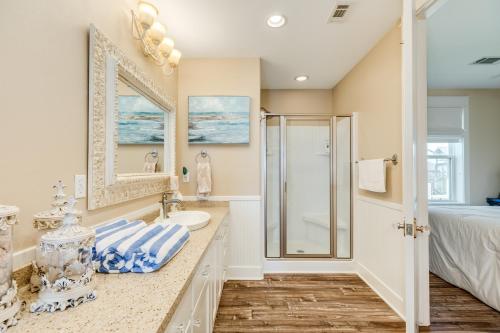 a bathroom with a sink and a shower at Exclusive Pool Gulf Views Modern Cargo Lift in Bolivar Peninsula