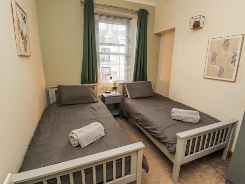 Postel nebo postele na pokoji v ubytování The Oaks Cottage