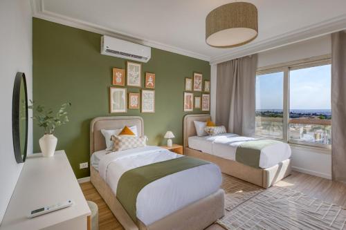 Ένα ή περισσότερα κρεβάτια σε δωμάτιο στο Prime Residence Golf Kattameya