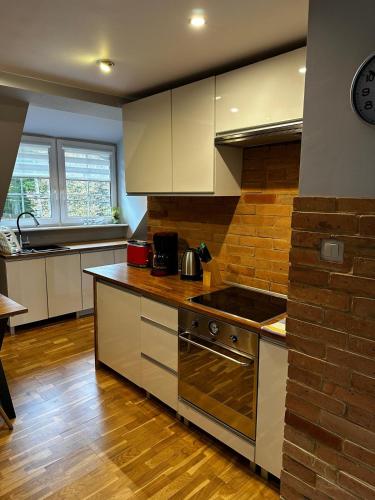 Kuchyň nebo kuchyňský kout v ubytování Apartament Familijny
