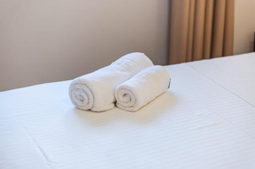 Ένα ή περισσότερα κρεβάτια σε δωμάτιο στο Hotel Riti