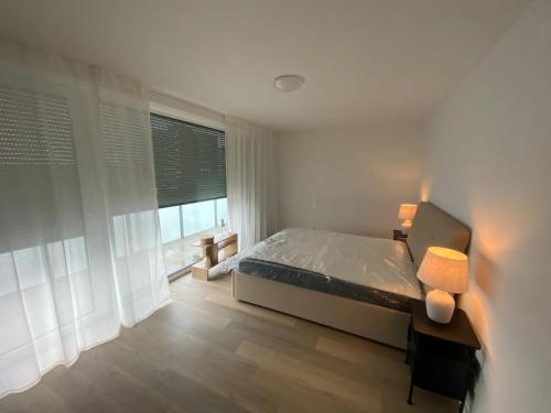 Postel nebo postele na pokoji v ubytování Quartiercenter Wohnung 1