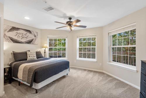 a bedroom with a bed and a ceiling fan at Restful Retreat - 2BDR for 6 in Kimberling City