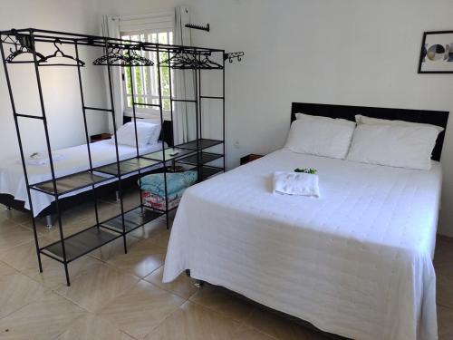 Postel nebo postele na pokoji v ubytování Refúgio dos pássaros