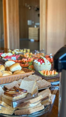 a buffet with many different types of food on a table at Boulevard Hotel Crateús in Crateús