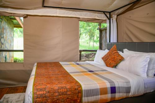 Postel nebo postele na pokoji v ubytování Oldarpoi Wageni Camps