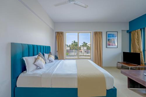 Postel nebo postele na pokoji v ubytování ASAR Landmark Suites