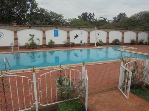 a large swimming pool in a building at Villa Leone Boutique Hotel in Nairobi