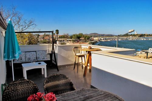 a balcony with a view of the water at Urla Marin otel in Izmir