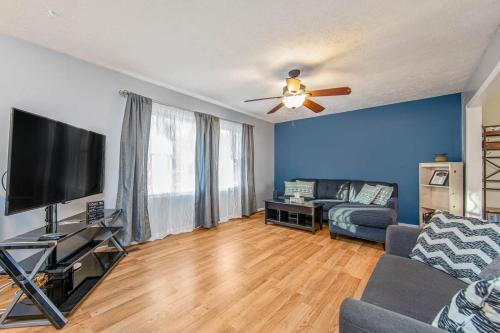 a living room with a couch and a flat screen tv at Reilly Road Refuge in Fort Bragg