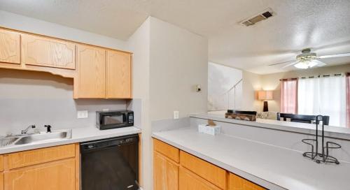 a kitchen with a sink and a microwave at Modern 2BR Stay with Large Parking Pet Friendly in Killeen