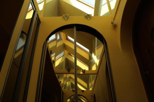 a window in a building with a reflection in it at Arkady in Słupsk