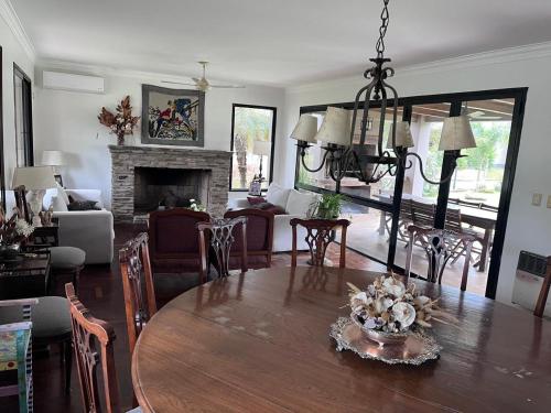 a living room with a dining table and a fireplace at Yerbabuena in Yerba Buena