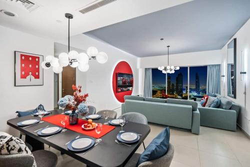 a living room with a table and a couch at Luxury Gate Tower Residence in Abu Dhabi