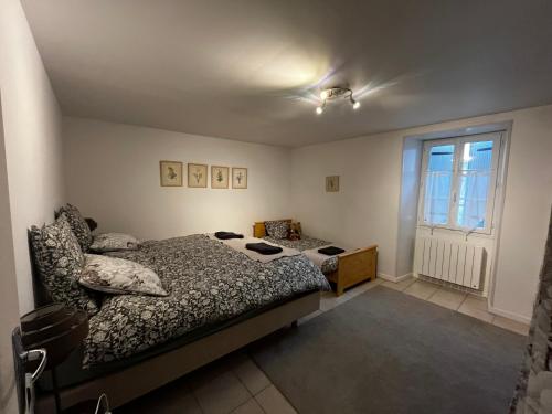 Katil atau katil-katil dalam bilik di Domaine de la Briouse