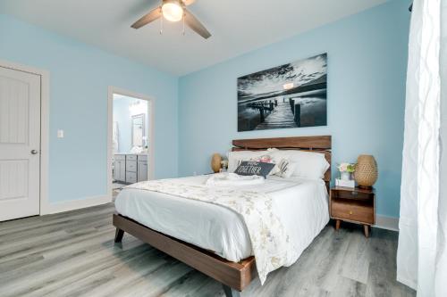 a bedroom with a bed and a ceiling fan at Prime Beachfront Large Deck Family Fun in Port Bolivar