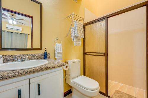 a bathroom with a toilet and a sink and a mirror at Casa Luna in Carpintero