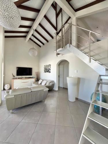 Postel nebo postele na pokoji v ubytování Villa Maëva, A l'entrée du Diamant