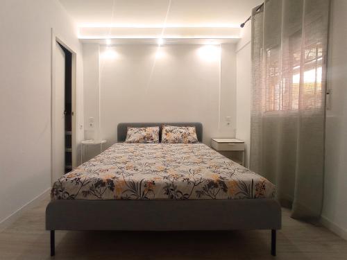 a bedroom with a bed in a white room at Las Américas Seafront - Free Wi-fi in Costa de Adeje