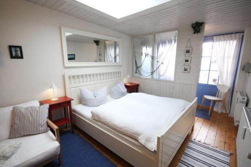 Ένα ή περισσότερα κρεβάτια σε δωμάτιο στο Warnemünde Ferienbungalow Diana 38559