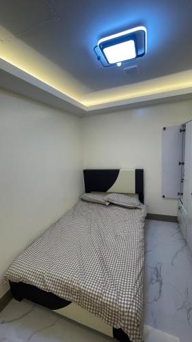 a bedroom with a bed in a room at Silang Guest house in Bangkal