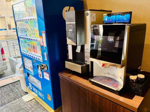 a coffee machine sitting on top of a counter at le Lac HOTEL Otsu Ishiyama in Otsu